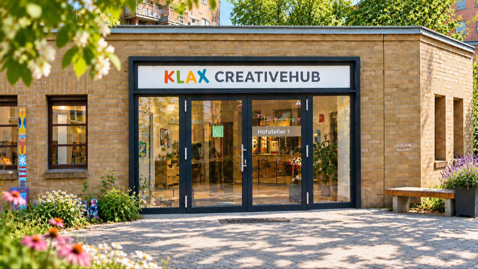 The entrance to Klax Creative Hub with studios around a green courtyard